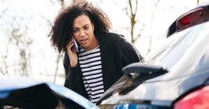 woman on the phone after a car accident