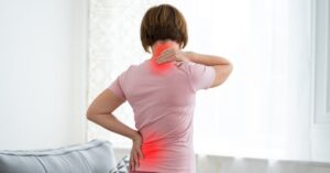 Woman with neck and back pain