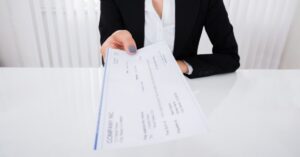 Woman presenting a check
